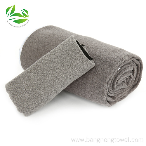 Yoga towel with corner pockets